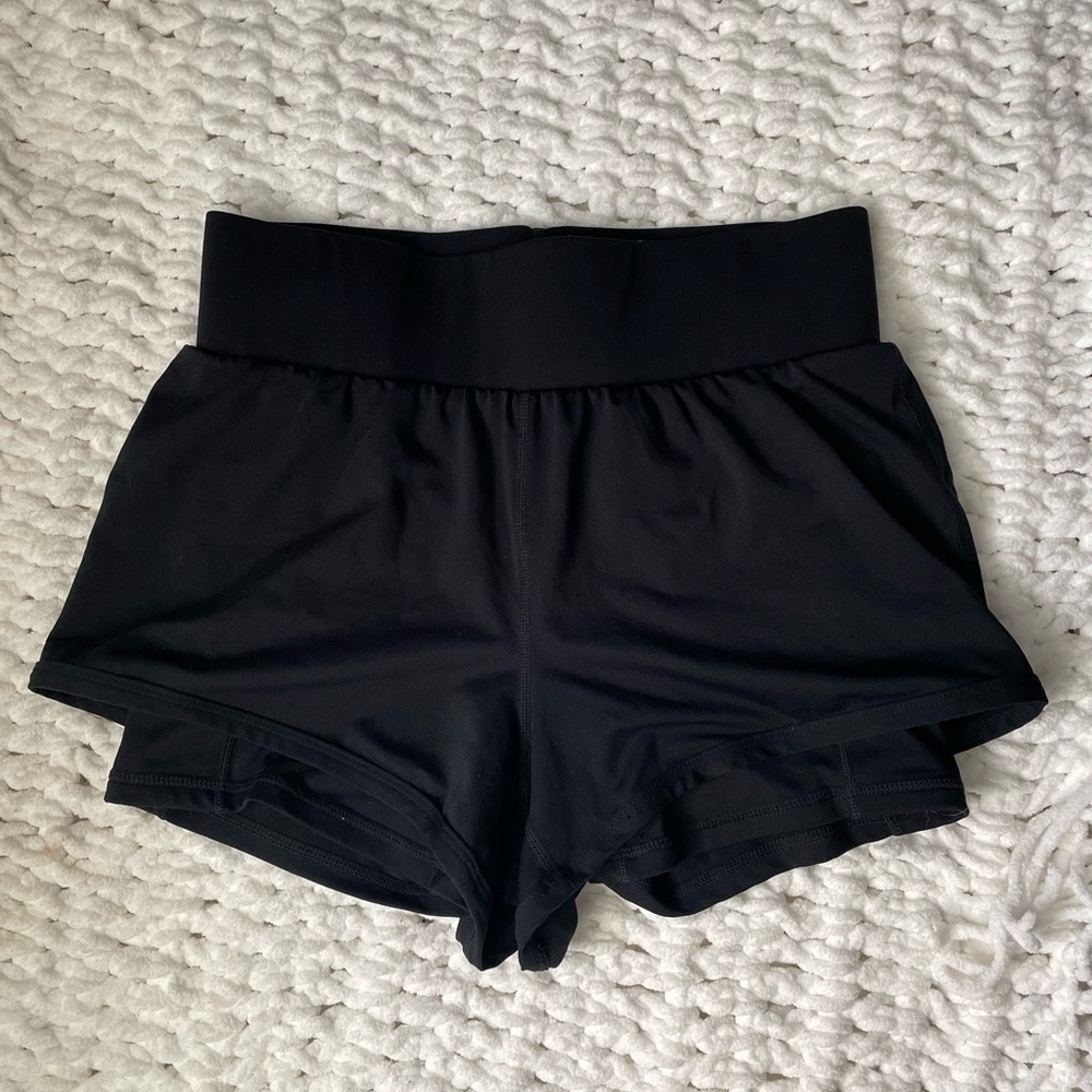 Fabletics— Black running shorts with attached spandex underneath